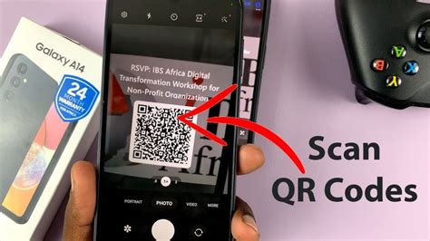 a person holding up a smart phone with a qr code attached to the screen