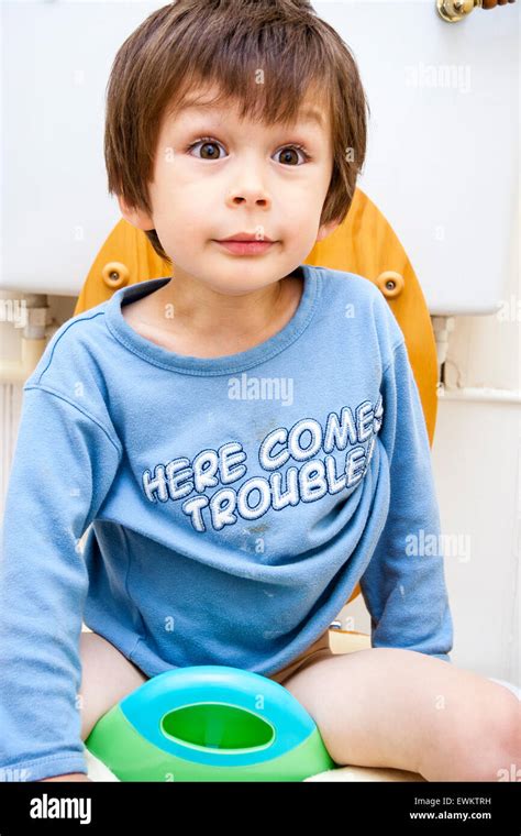 Young boy sitting on toilet hi-res stock photography and images - Alamy