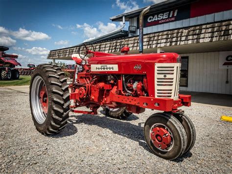 There's something beautiful about seeing a fully restored tractor. Check out this Farmall 450 ...