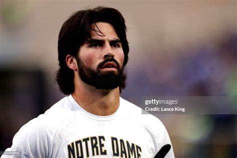 Sam Hartman of the Notre Dame Fighting Irish looks on prior to the ...