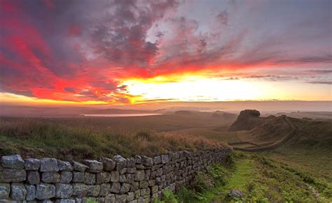 Sunrise on Hadrian's Wall viewed from Cuddy's Crags near Housesteads Fort, Northumberland ...