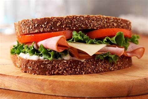 This All-American Ham Sandwich on multi-grain bread is a classic, made with tangy dressing ...