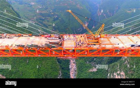 Aerial view of the Beipanjiang Bridge, the world's highest bridge, under construction over the ...