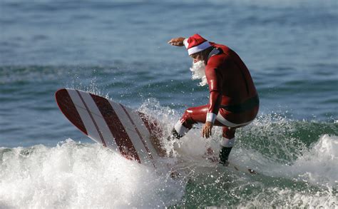 Surfing Santa brings smiles with surf to the beach cities - Surfing LA