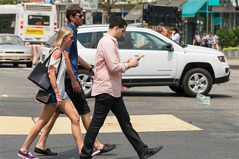 Best Distracted Walking Stock Photos, Pictures & Royalty-Free Images - iStock