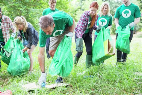 Environmentalist volunteers picking up trash - Stock Photo - Dissolve