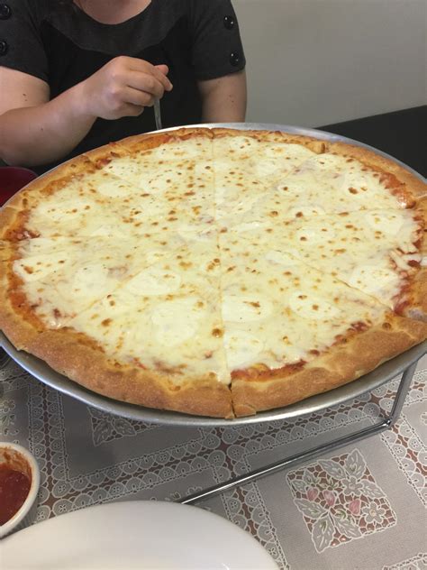 Cheese pizza with extra fresh mozzarella. Mad Hatter's Pizza, Oviedo, FL. : r/Pizza