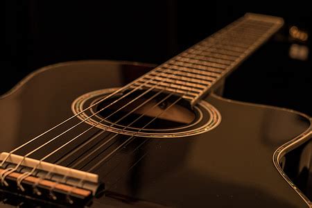 Royalty-Free photo: Black acoustic guitar | PickPik