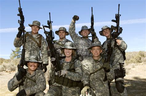 Military Team Together With Weapons - The Military Reunion Network