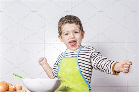 Child spotted with flour at kitchen containing 3, adorable, and arms ...