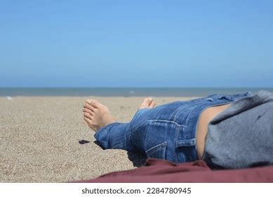 Bare Feet Woman Lying On Beach Stock Photo 2284780945 | Shutterstock