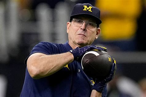 Watch Michigan’s Jim Harbaugh get surprise hug from brother John in ...