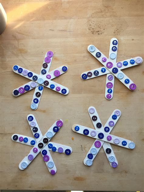 Winter craft - Popsicle stick snowflakes with buttons | Popsicle stick ...