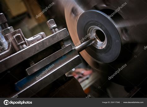 Metal Worker Shaping Metal Lathe Stock Photo by ©tcsaba 204117546