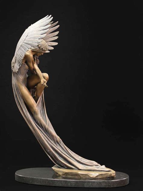 A sculpture of an ethereal angel seems to float above the ground ...