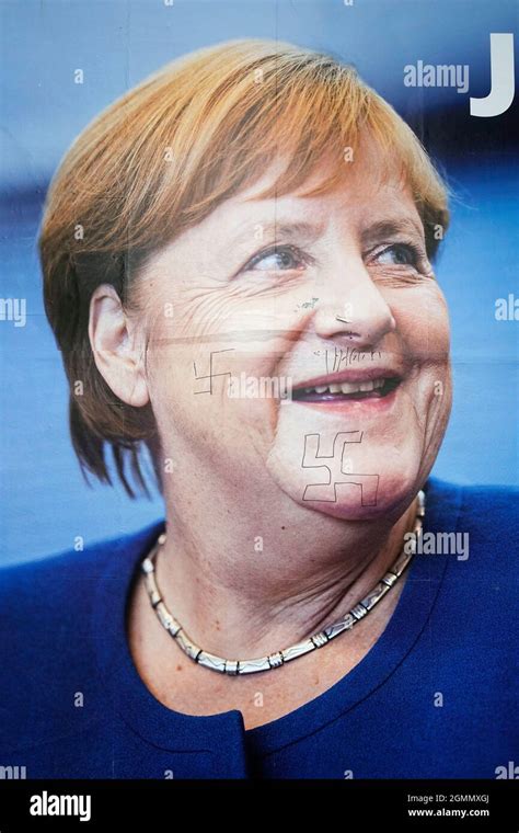 Poster, Angela Merkel, defaced with swastikas, Berlin Stock Photo - Alamy