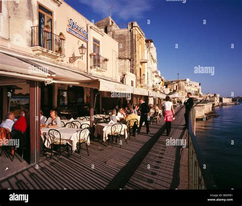 Waterside restaurants Ortygia or Ortigia Siracusa or Syracuse Sicily Stock Photo, Royalty Free ...