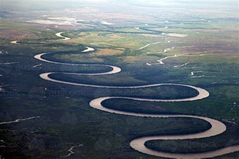 Image of Aerial view of a curving river system - Austockphoto