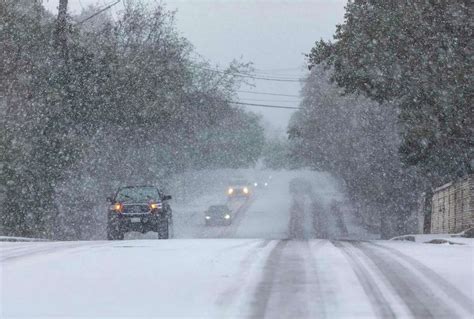 Photos show snow falling in San Antonio, Texas