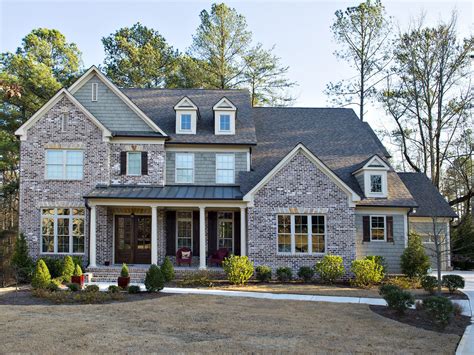 Traditional home with brick and siding exterior | House exterior, Brick ...