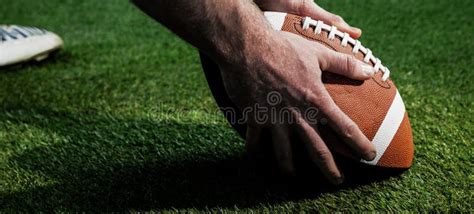 Close Up View of American Football Player Preparing for a Drop Kick ...