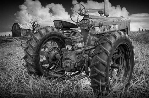 Black and White of Old Farmall Tractor in a Grassy Field Photograph by ...