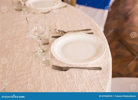 Elegant Empty Plate, Cutlery, Napkin and Glass on a Table. Stock Photo ...