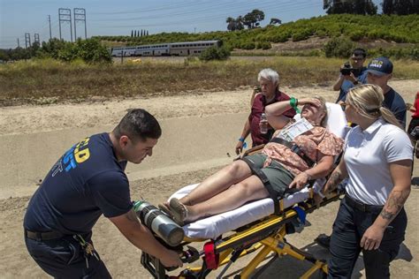 Amtrak train with almost 200 passengers derails after hitting water truck on tracks in Southern ...