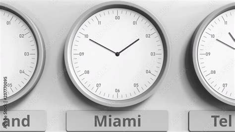 Round clock showing Miami, USA time within world time zones. 3D ...