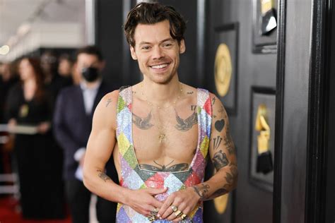 Harry Styles Is in a Rainbow Paradise Wearing a Sparkly Jumpsuit — and ...