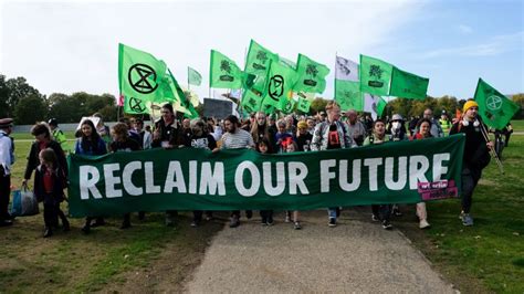 A group best known for its disruptive climate protests is hitting pause ...