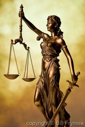 Statue of Lady Justice Holding Scales of Justice