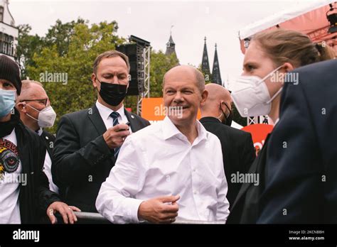 supporters line up for selfie with Social Democratic party candidate Olaf Scholz after the ...