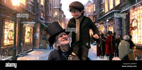 EBENEZER SCROOGE, TINY TIM, A CHRISTMAS CAROL, 2009 Stock Photo - Alamy