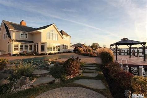 What a beautiful Long Island beach home with a lovely sunset | House designs exterior, House ...