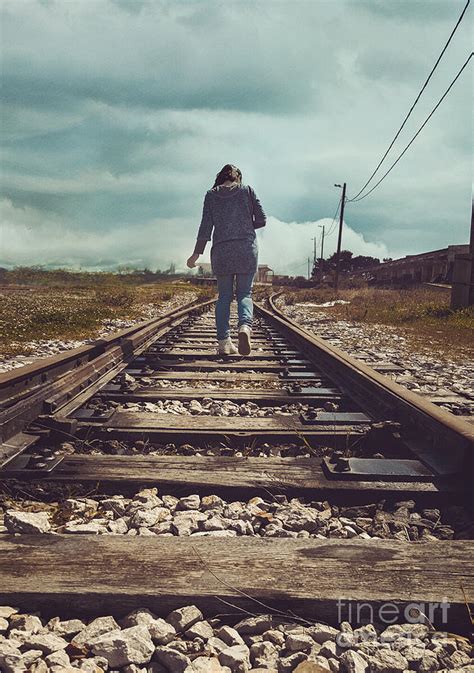 Woman on train tracks Photograph by Mythja Photography | Fine Art America