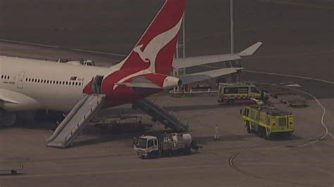 Qantas flight evacuated using slides as cabin starts to fill up with ...