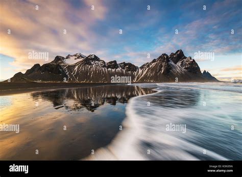 Stokksnes, Hofn, East Iceland, Iceland. Vestrahorn mountain reflected on the shore at sunset ...