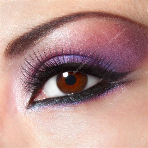 Modern fashion violet makeup of a female eye - macro shot — Stock Photo © vfoto #4691152