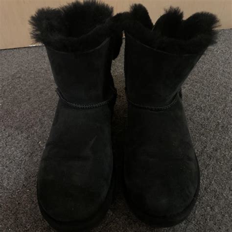 UGG black boots with fluffy bow on back only worn a... - Depop