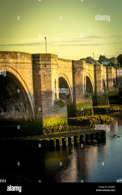 Berwick Bridge, also known as the Old Bridge, spans the River Tweed in ...