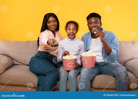 Emotional African American Family of Three Watching Movie, Young ...