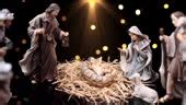 Jesus Christ Nativity Scene With Figurines And Light Particles Stock ...