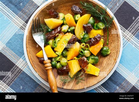 Roasted Yellow Beets with Brussels Sprouts and Dates Stock Photo - Alamy