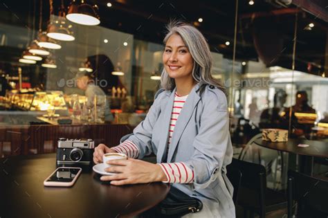 Confident female with happy face posing outdoors Stock Photo by KostiantynVoitenko