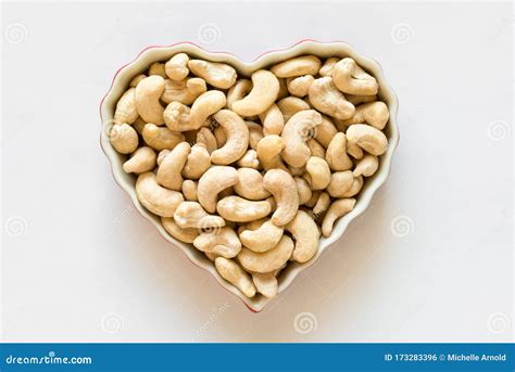 Raw Cashews in a Heart Shape Stock Photo - Image of valentine, love ...