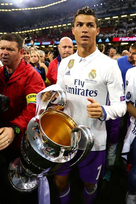 CARDIFF, WALES - JUNE 03: Cristiano Ronaldo of Real Madrid holds the trophy following the UEFA ...