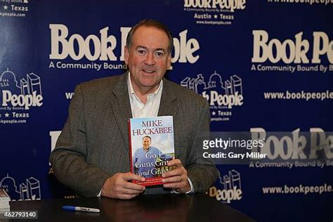 Mike Huckabee Signs Copies Of His New Book God Guns Grits And Gravy Photos and Premium High Res ...