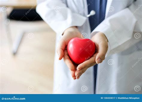 Beautiful Woman Doctor with the Stethoscope Holding Heart. Stock Image ...