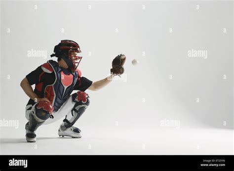 Baseball catcher against white background Stock Photo - Alamy